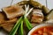 Homemade ukrainian borsch - beetroot soup in a bowl. Green onion, bread, bacon with herbs and pickles