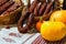 Homemade Ukrainian sausage on traditional embroidered tablecloth is sale at the market