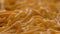 Homemade uncooked long pasta tonnarelli like spaghetti on wooden board close up focus shot animation