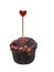 Homemade valentine cupcakes with red sugar hearts, chocolate muffin with heart, symbol of love