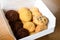 Homemade vanilla, orange, lemon chocolate chip cookies biscuits stack on a white plate