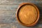 Homemade vegan cake or sourdough bread with carrots bran from spelt dinkel wheat flour in clay baking form on rustic wooden table