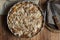 Homemade Vegan Eggless Whole Apple Cake in Round Baking Form. Wood Table Dark Plates Linen Napkins. Cozy Fall Autumn Atmosphere