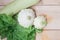 Homemade vegetables. Squash Squash white and lettuce on a wooden background. Green harvest on wooden background. Courgettes on a