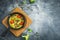 Homemade vegetarian soup in white bowl on dark backgroundHealthy vegetarian omelet in frying pan and pumpkin seeds. Flat lay, top