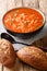 Homemade vegetarian tomato rice soup close up in a bowl. vertical