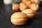 Homemade walnut shaped cookies on black table, closeup
