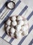 Homemade white mexican wedding cookies on pink plate, overhead view. Close-up