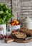 Homemade whole grain bread, fresh green salad and tomatoes on a light rustic wood background.