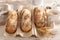 Homemade wholegrain baguettes baking in sesame and flax seeds