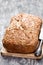 Homemade wholemeal rye bread with flax seeds on wooden table