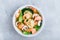 Homemade Wonton Soup with dumplings, brown mushrooms, bok choy and shrimps