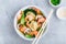 Homemade Wonton Soup with dumplings, brown mushrooms, bok choy and shrimps
