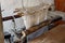 A homemade wooden loom closeup in a Nepalese house. Trekking to the closed zone of Upper Mustang. Nepal.