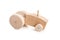 Homemade wooden tractor toy on white background