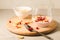Homemade yogurt with garnet grains and flakes in glass/Homemade yogurt with garnet grains and flakes in glass on a wooden tray and
