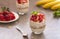 Homemade yogurt parfait with granola, strawberries, bananas and Chia seeds in glasses. Diet dessert with yogurt.