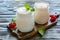 Homemade yogurt and sour baked milk in glass jars.