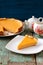 Homemade yummy pumpkin pie and teaware on old table painted blue