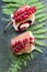 Homemade yummy yeast buns with red currants on a fern leaf