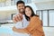 Homeowner, couple and show keys to new house, being happy and successful with smile, relax and hug. Portrait, black man