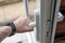 Homeowner seen gripping the handle of a newly installed uPVC high security door.