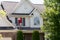 Homeowner washing the exterior of his house