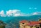 Homes at the edge of the hill in the city of Gangtok,Sikkim,North India with the hills and the blue sky on the background