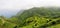 Homes, farmland, and cattle on the mountaintop