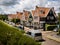 Homes in Volendam, Holland,  neatly line a brick-surfaced street