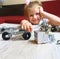 Homeschooling ,child designs,  Screw driver, nuts, wrench, bolts and parts of children`s metallic constructor. children`s metal