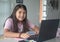 Homeschooling - child studying at desk looking at camera