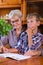 Homeschooling grandmother teaching smart boy, child