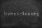 Homeschooling. Word Homeschooling written on an old blackboard