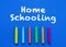 Homeschooling. Words or typed text on blue board. Colorful crayons. Top view