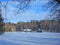 Homestead near forest in winter, Lithuania