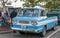 Homestead, Pennsylvania, USA July 21, 2021 A blue with white stripes Chevrolet Corvair Rampside truck from the 1960s