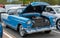 Homestead, Pennsylvania, USA July 21, 2021 A two toned blue and white 1955 Chevrolet Bel Air Coupe with it`s hood raised