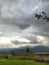 Hometown. A House on the edge of a rice field. Beautiful view of the mountains and clouds