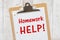 Homework Help message on lined paper with a clipboard