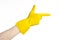 Homework, washing and cleaning of the theme: man\'s hand holding a yellow and wears rubber gloves for cleaning isolated on white ba