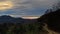 Homolje mountains landscape with a winding gravel country road at sunset of an autumn sunny day