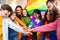 Homosexual diverse group of young people stacking hands together outdoors