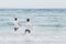 Homosexual portrait young asian couple running with cheerful together on beach in summer