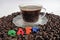 Honduras coffe beans on white surface with a cup of fresh brewed coffe name label 12