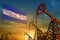 Honduras oil industry concept. Industrial illustration - Honduras flag and oil wells against the blue and yellow sunset sky