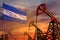 Honduras oil industry concept. Industrial illustration - Honduras flag and oil wells with the red and blue sunset or sunrise sky