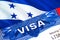 Honduras Visa in passport. USA immigration Visa for Honduras citizens focusing on word VISA. Travel Honduras visa in national