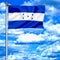 Honduras waving flag against blue sky