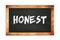 HONEST text written on wooden frame school blackboard